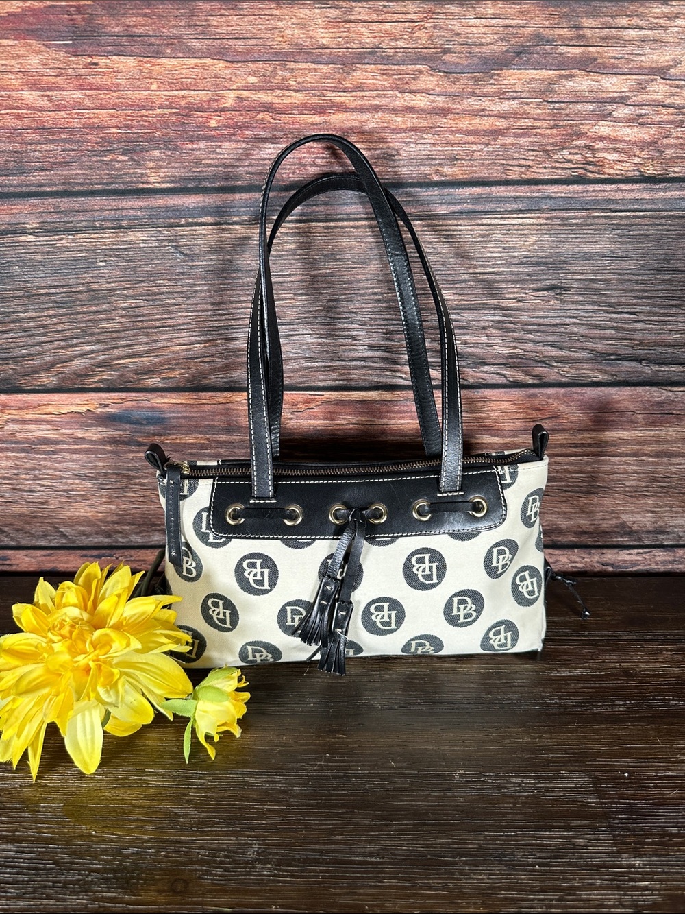 Dooney & Bourke Vintage logo jacquard handbag in cream and black.